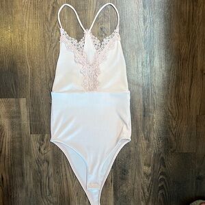 Pink lace body suit